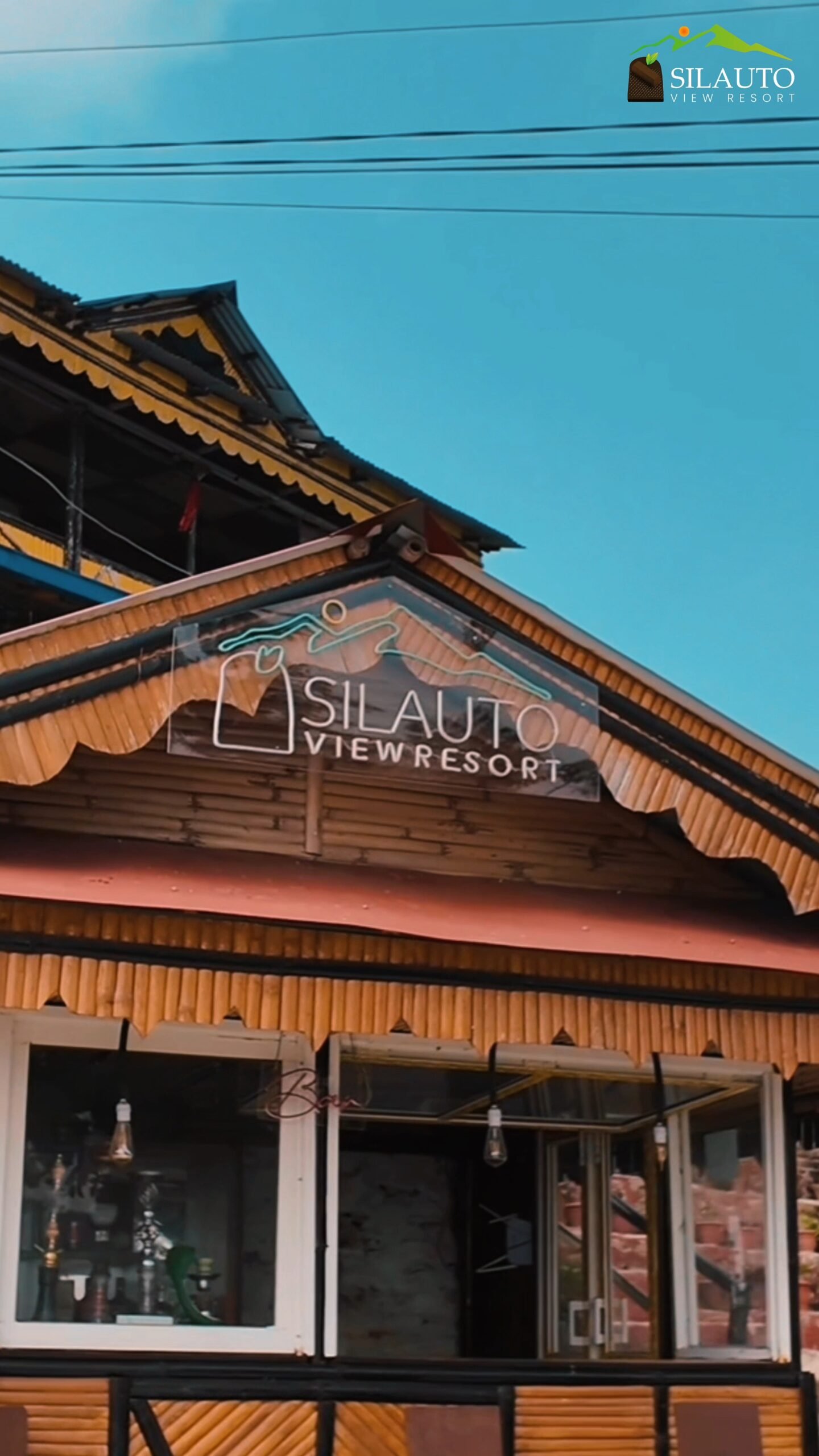 image of silauto view resort transparent logo board in top of its bar area.